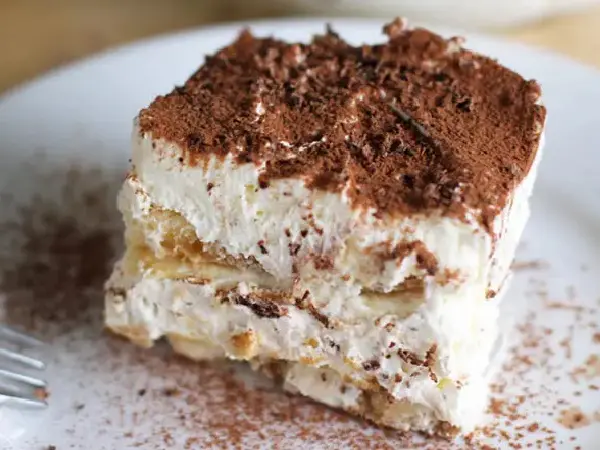 A close up of a piece of cake on top of a plate.