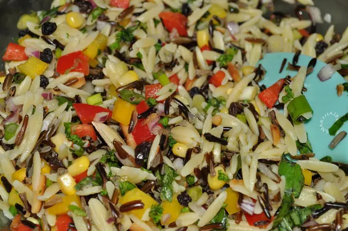 A close up of rice and vegetables in a bowl