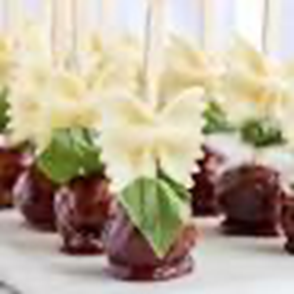 A close up of some chocolate covered apples