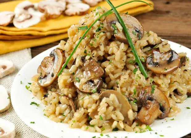 A plate of food with rice and mushrooms.