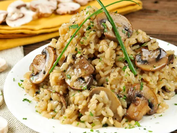 A plate of food with rice and mushrooms.