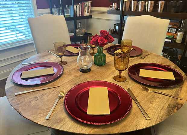 A table set with plates and glasses on it